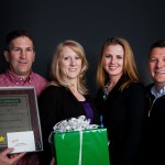 Mid-Market Dealer of the Year Eugene Harwell of DogWatch of North Alabama with his wife Shannon, installer's wife Charlotte Hill, and installer Jeff Hill.